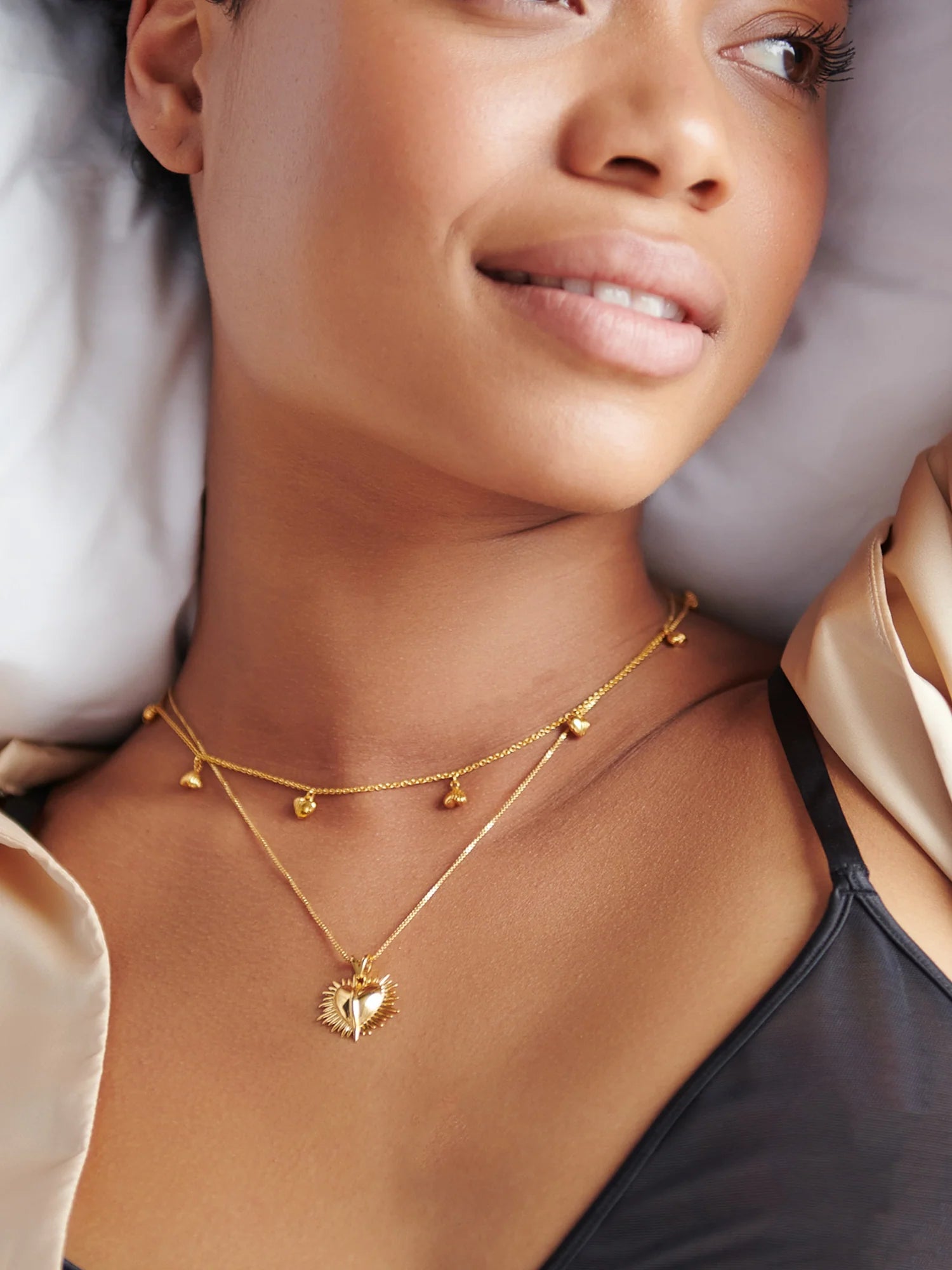 gold necklace with gold heart charms from rachel jackson