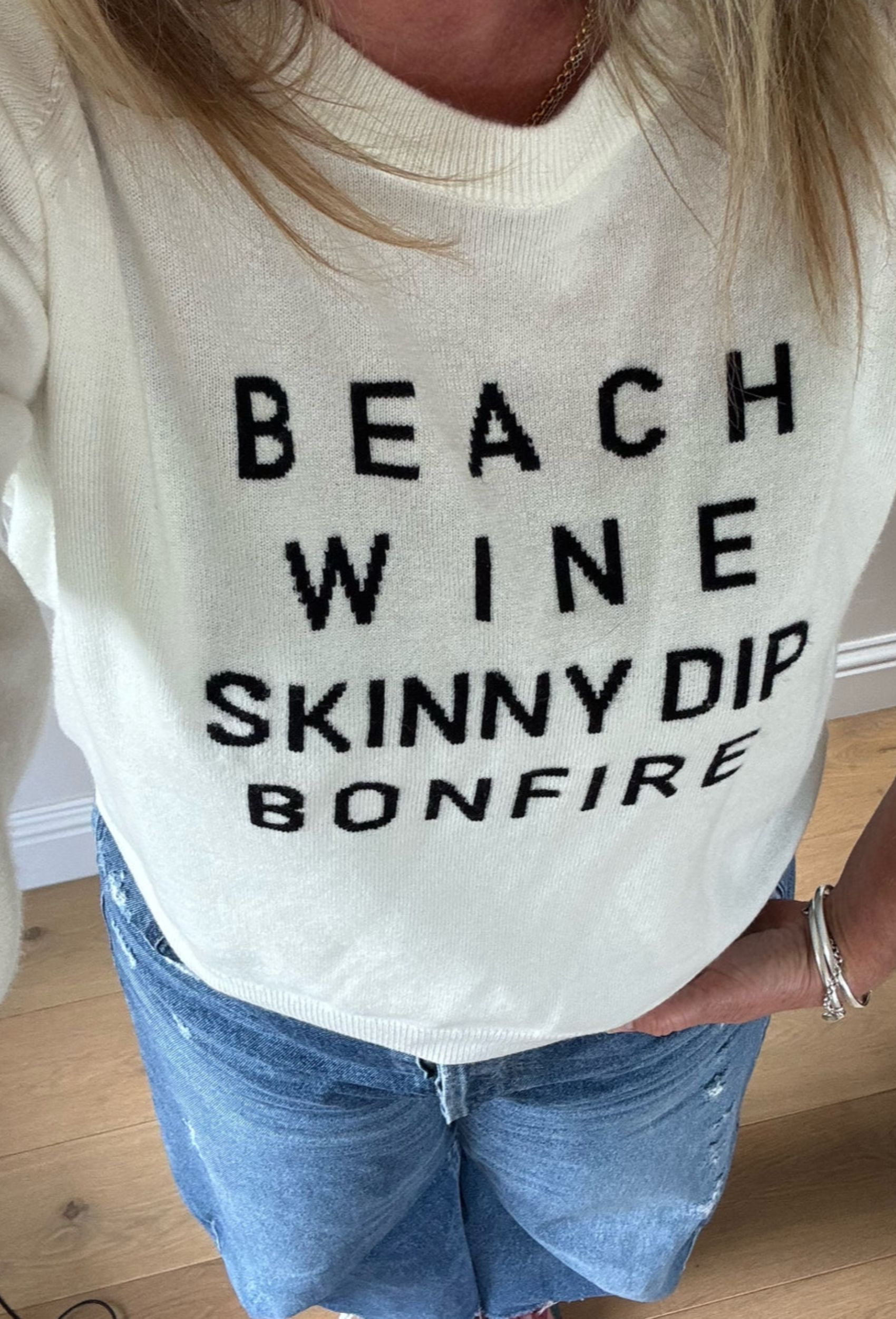 white jumper with beach wine skinny dip bonfire slogan