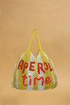 yellow and white string bag on yellow background