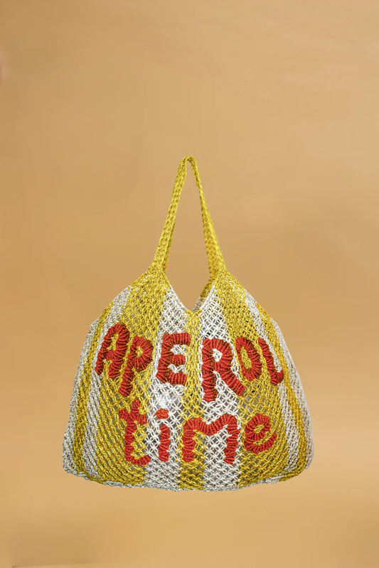 yellow and white string bag on yellow background