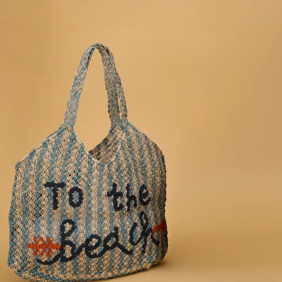 blue and beige string bag on yellow background