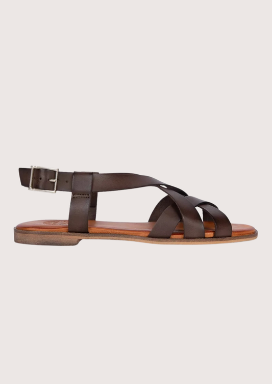 Brown sandal with a strap design on a light gray background
