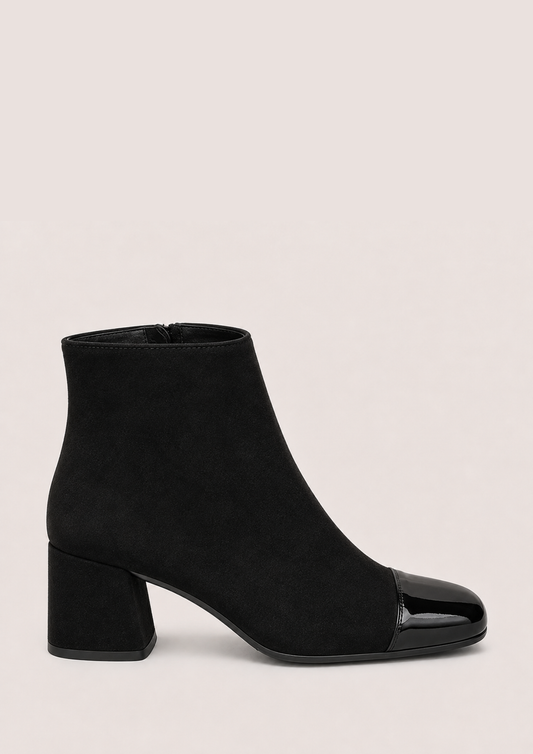 Black leather boot with laces on a white background