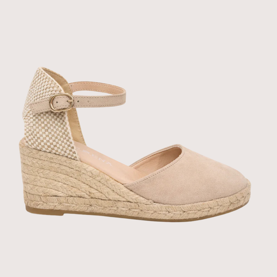 Beige wedge sandal with espadrille sole on a white background