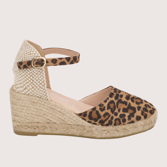 Wedge sandal with leopard print on a white background