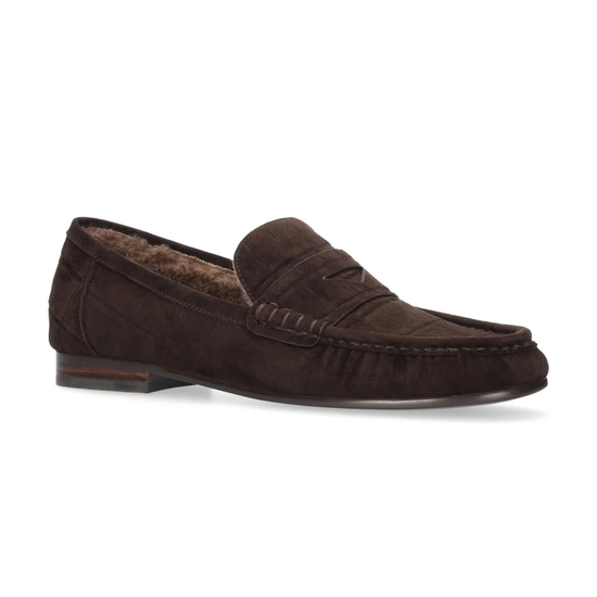 A pair of dark brown suede slip-on loafers with a plush brown faux-fur lining, shown from a top-down view on a white background. The brand name 'BIBI LOU' is visible on the insole.