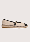 Beige flat shoe with black cap-toe and woven sole 