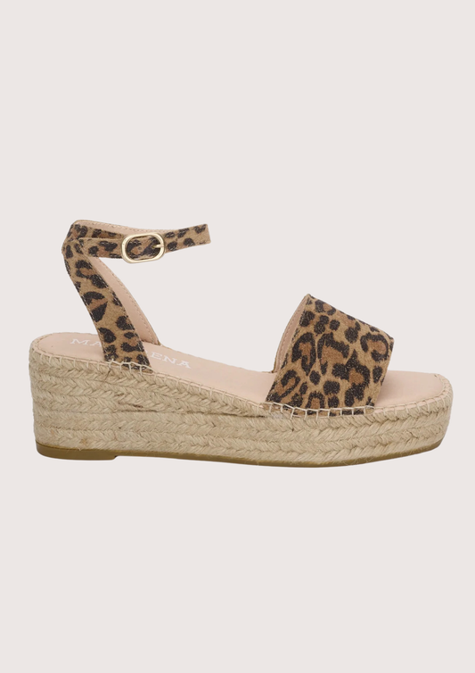 Leopard print wedge sandal on a light gray background