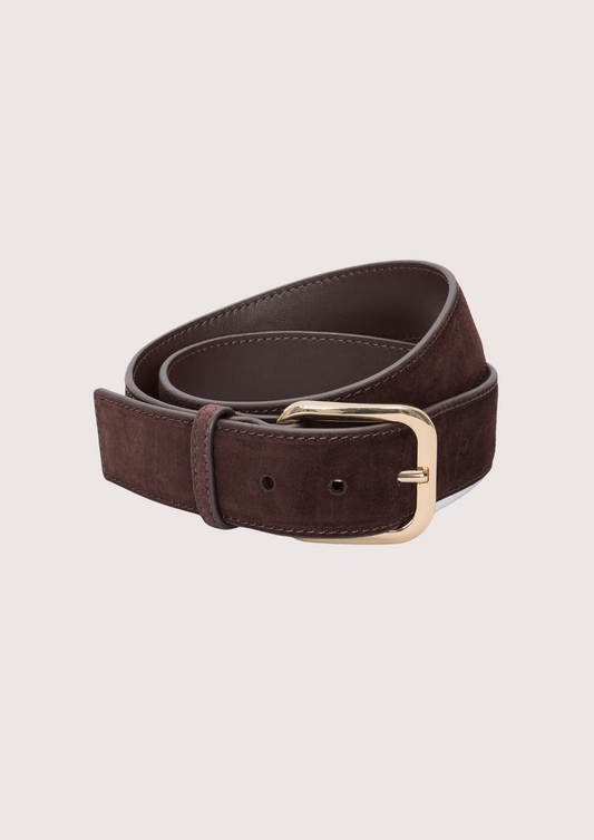 A dark brown suede belt with a polished gold-tone metal buckle, neatly coiled on a light beige background.