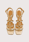 gold and silver sandal on a white background
