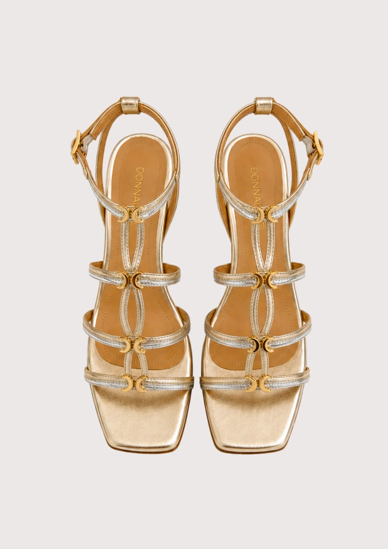 gold and silver sandal on a white background
