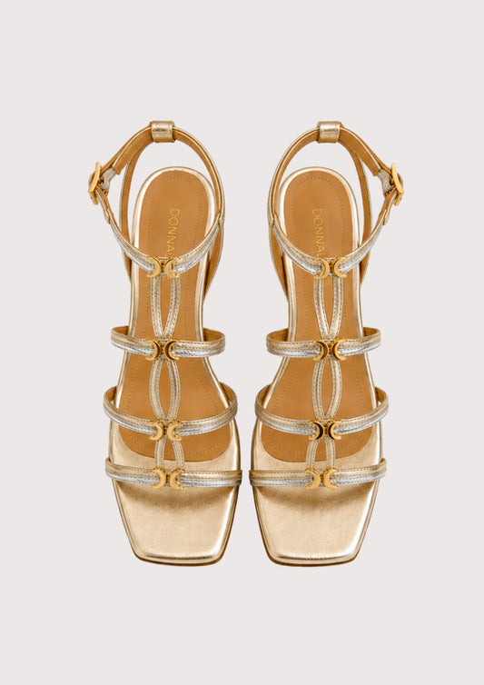 gold and silver sandal on a white background