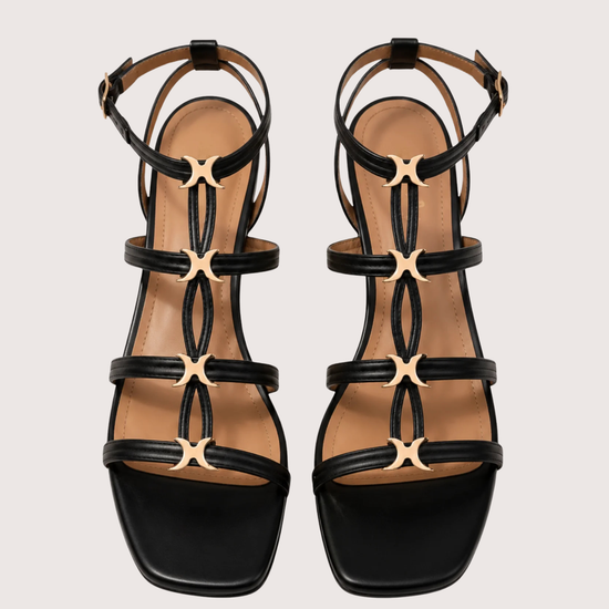 black sandal with gold hardware