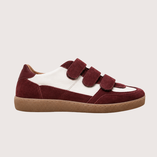 burgundy trainer with velcro straps on a white background