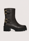 A black leather ankle boot with a chunky lug sole and two gold-tone buckle straps on the side, shown against a light gray background.