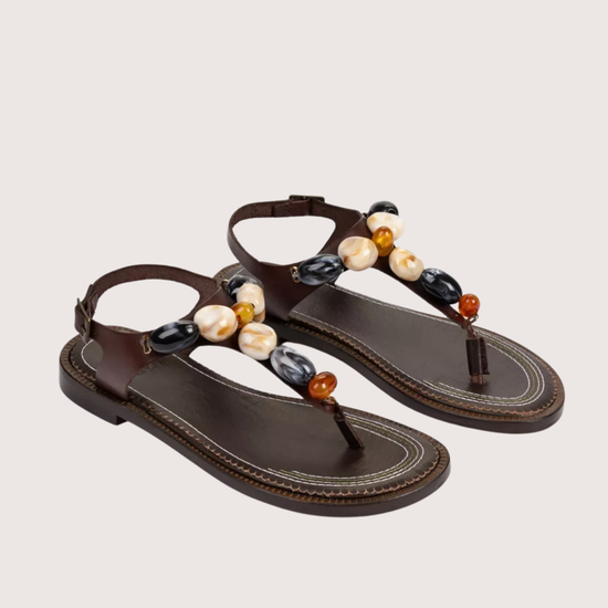pair of brown sandals with stone detail 