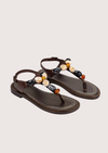pair of brown sandals with stone detail 