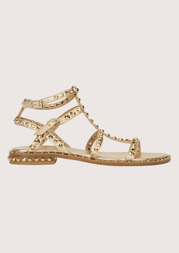 Gold sandal with gold studs on a white background side profile 