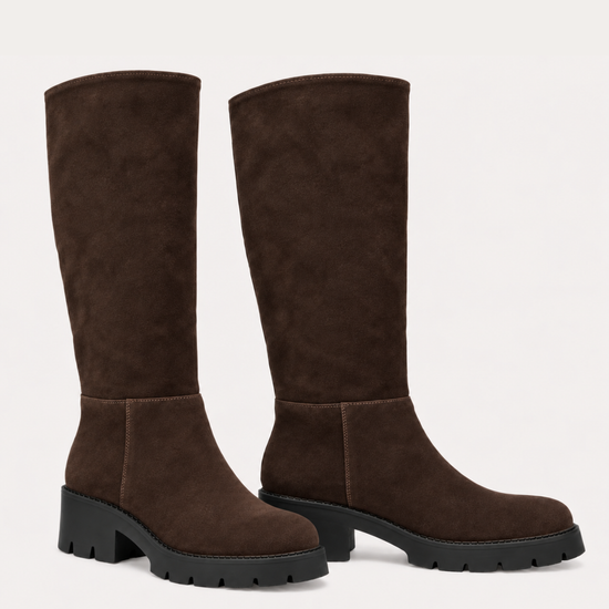 A pair of dark brown suede knee-high boots with chunky black block heels, shown against a plain off-white background.