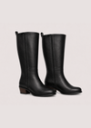 Flat lay image of two leather boots side on on a white background 