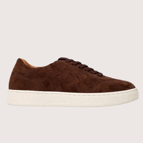 Woven brown trainer on a white background