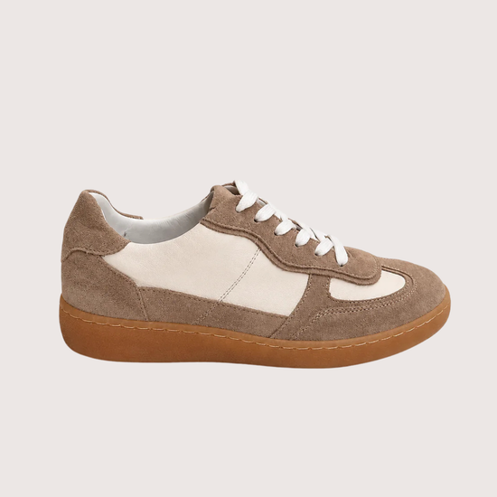 Brown and white trainer with tan sole on a light gray background