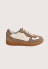 Brown and white trainer with tan sole on a light gray background