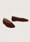 Burgundy suede flat shoe on a white background