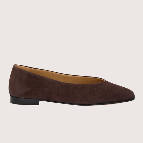 Brown suede flat shoe on a light gray background