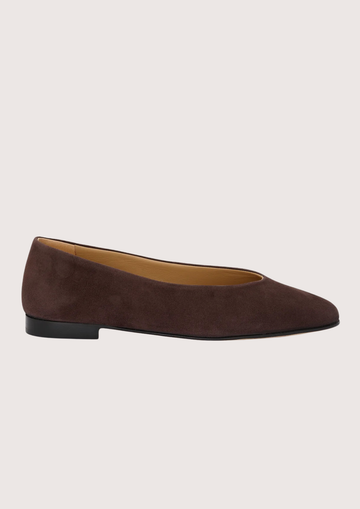 Brown suede flat shoe on a light gray background