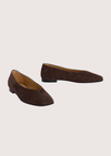Pair of brown suede shoes on a light gray background