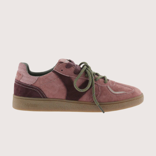 A low-top suede sneaker in dusty rose pink with dark burgundy side panels, olive green laces, and a gum brown sole, shown from a side profile on a light gray background.