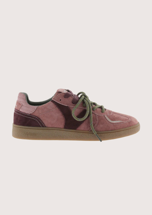 A low-top suede sneaker in dusty rose pink with dark burgundy side panels, olive green laces, and a gum brown sole, shown from a side profile on a light gray background.