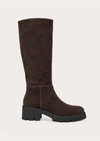 A dark brown suede knee-high boot with a chunky black lug sole and block heel, shown from a side profile on a light beige background.
