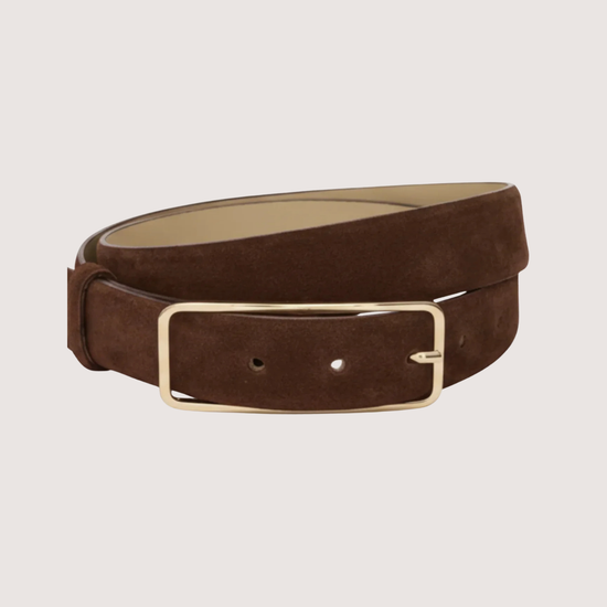 brown suede belt with gold hardware on plain background