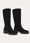 A pair of black knee-high suede boots with chunky lug soles and block heels, shown against a plain off-white background.