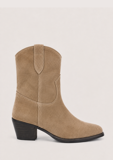 A single mid-calf western-style boot in beige suede with a black block heel and black outsole, shown from a side profile against a light gray background.