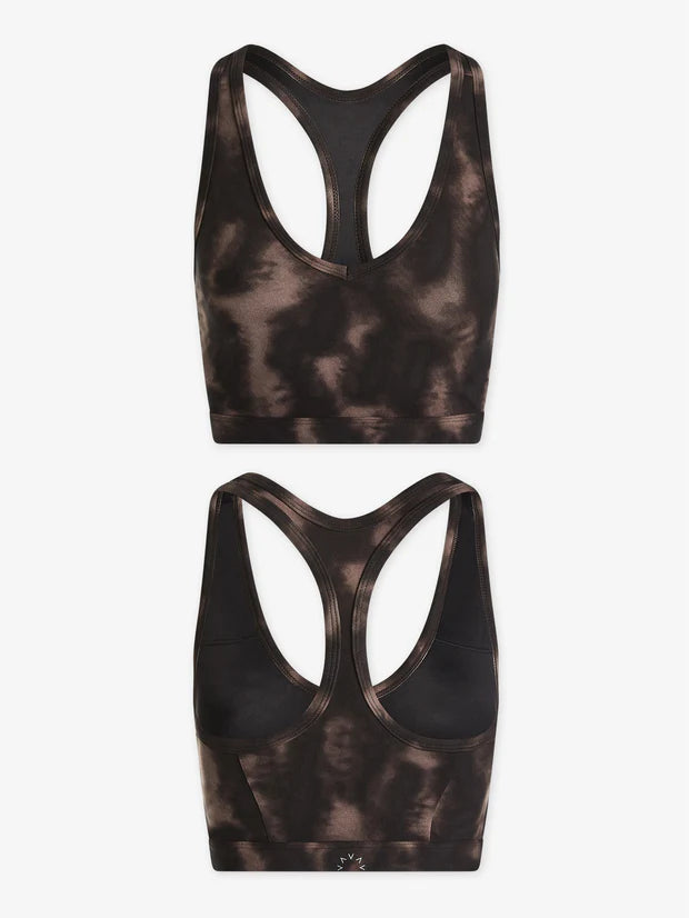Sports bra with scoop front and razor back in black and brown blurred print