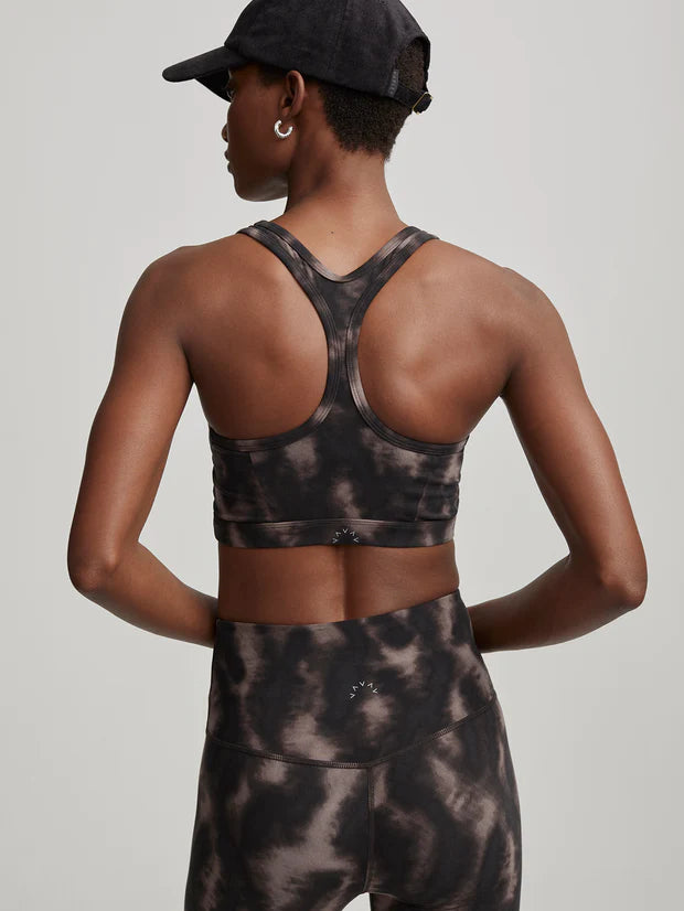 Sports bra with scoop front and razor back in black and brown blurred print