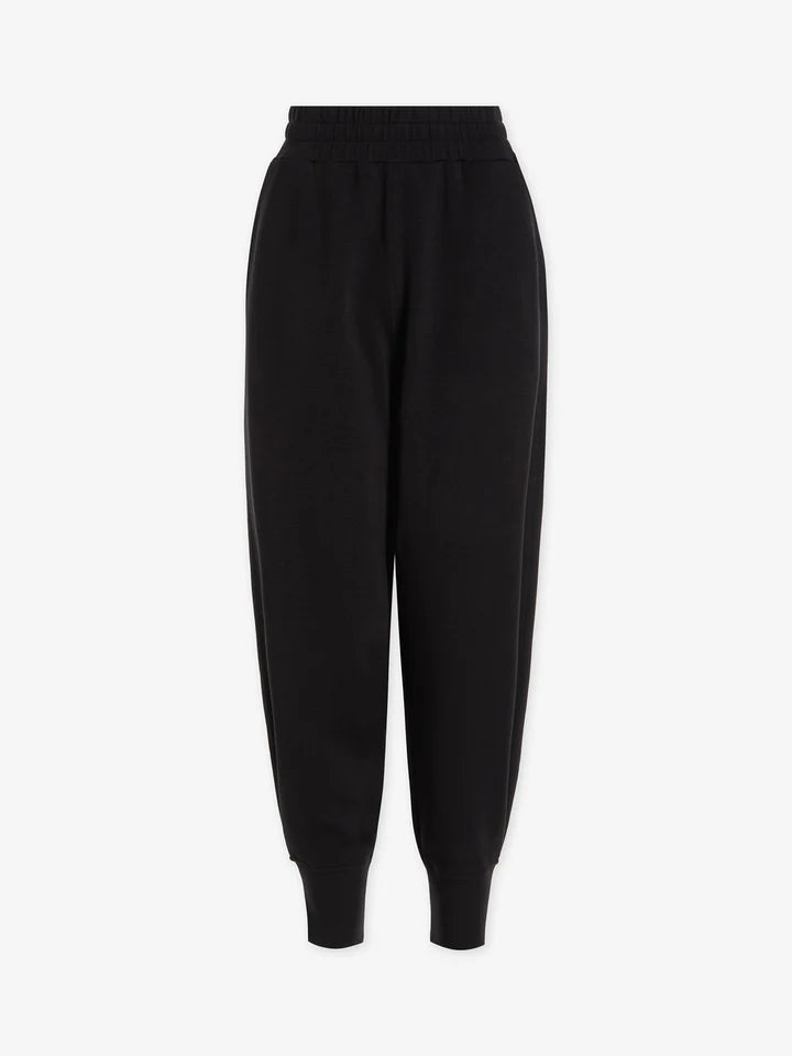 Relaxed jogging style trousers with side slant pockets rear welt pockets and elasticated waistband