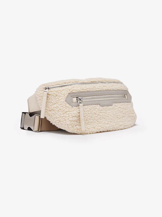 cream sherpa belt bag with 2 zipped pockets side view