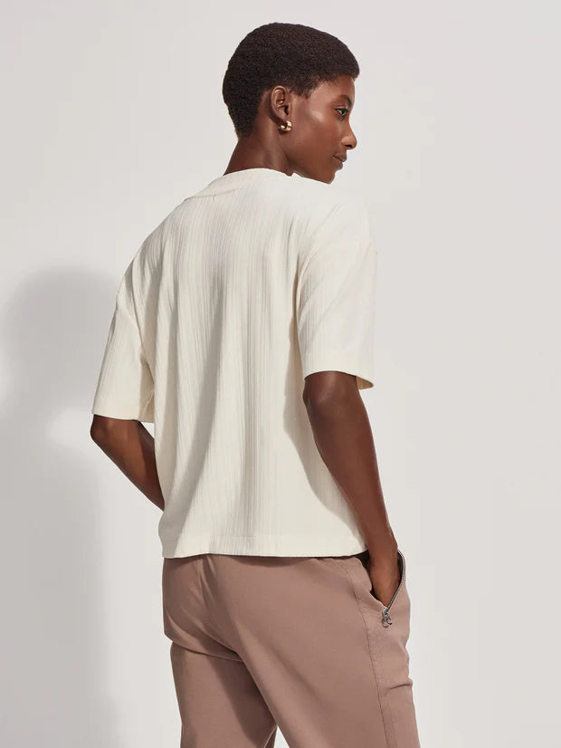 Ecru short sleeved tee with half placket and button fastening