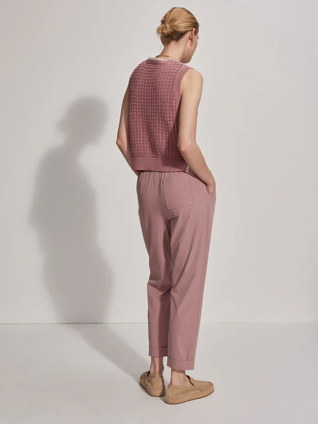 Pink pull on trousers with an elasticated waistband and side pockets rear view