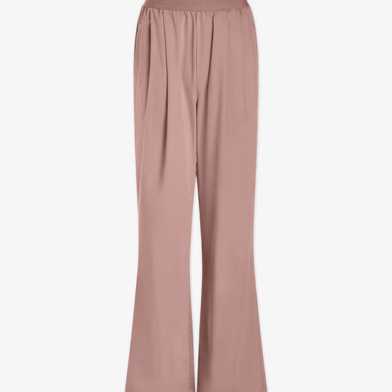 Pale pink trousers with an elasticated waistband  and side pockets