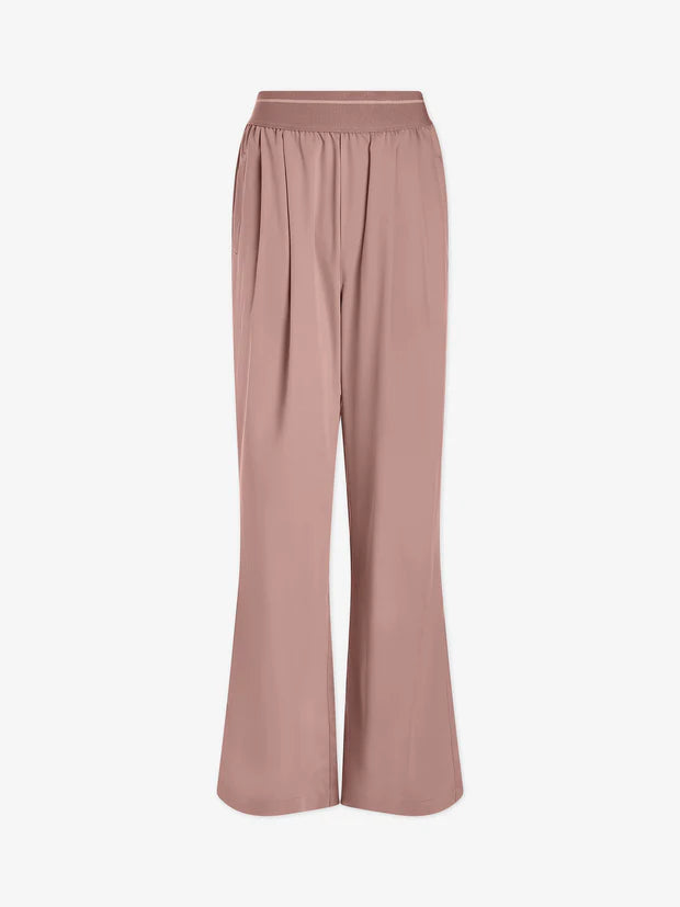 Pale pink trousers with an elasticated waistband  and side pockets