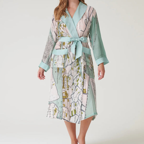 Woman wearing a patterned robe on a white background