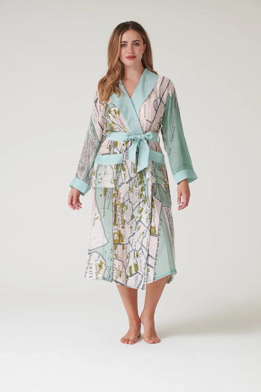 Woman wearing a patterned robe on a white background