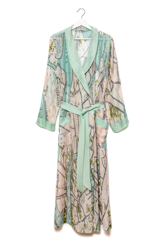 Map-patterned robe with green accents on a hanger against a white background