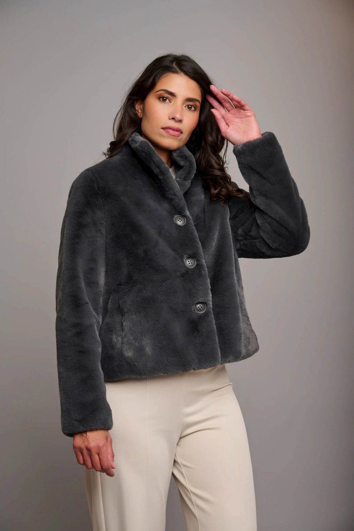 Short deep grey faux fur jacket with button fastening and classic collar