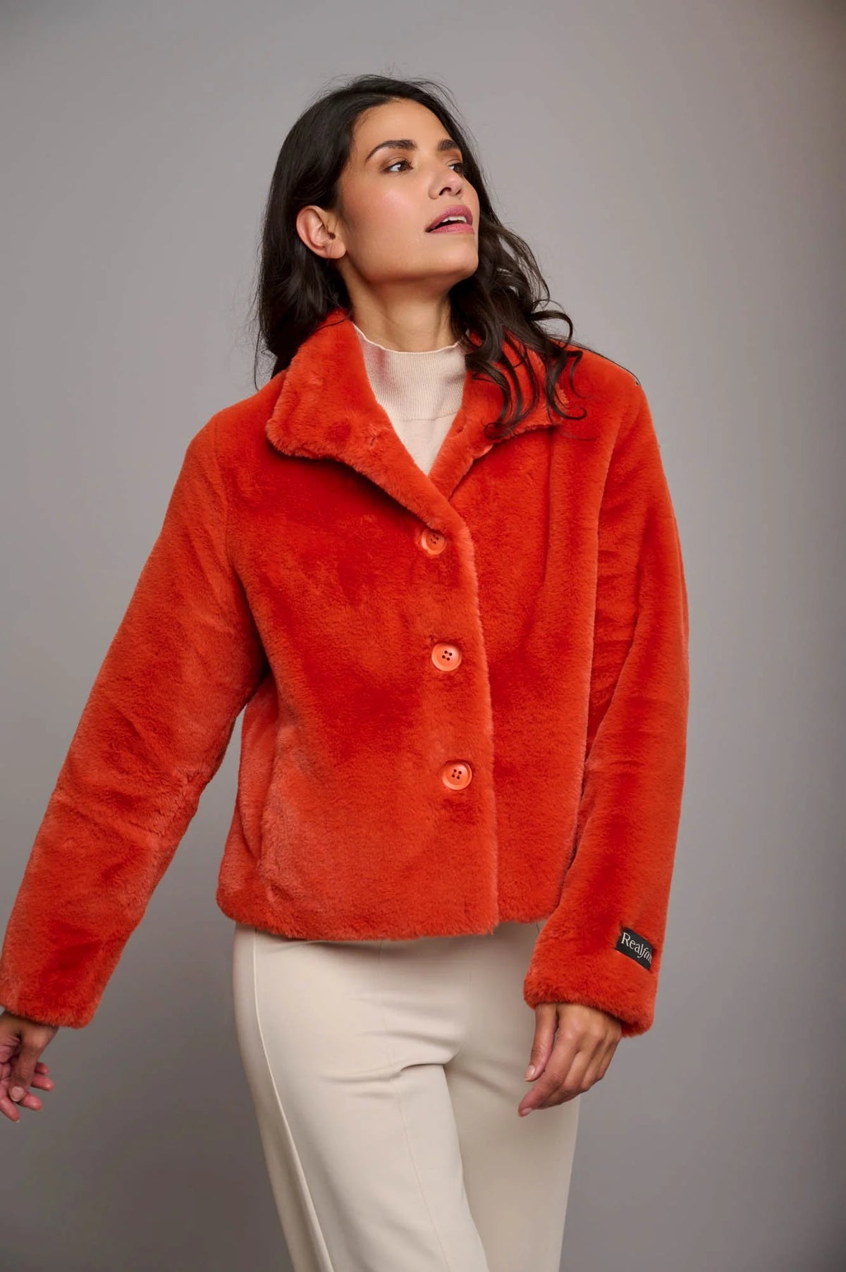 Terracotta orange short faux fur jacket with classic collar